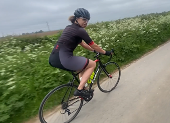Female cycling on a country lane